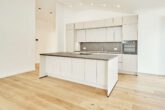 Besondere Ausstattung - Dachgeschosswohnung mit Fußbodenheizung und hohen Decken zum Erstbezug - Einbauküche_2